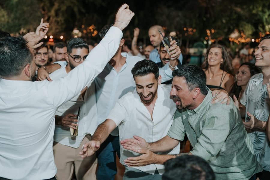 Friends dancing and hugging on the dance floor