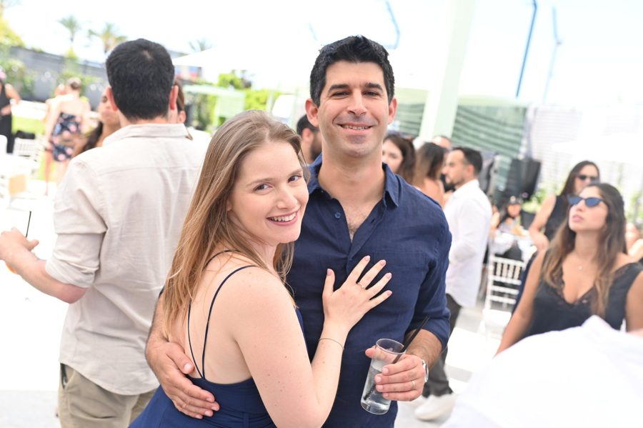 A group of friends smiling together at an event