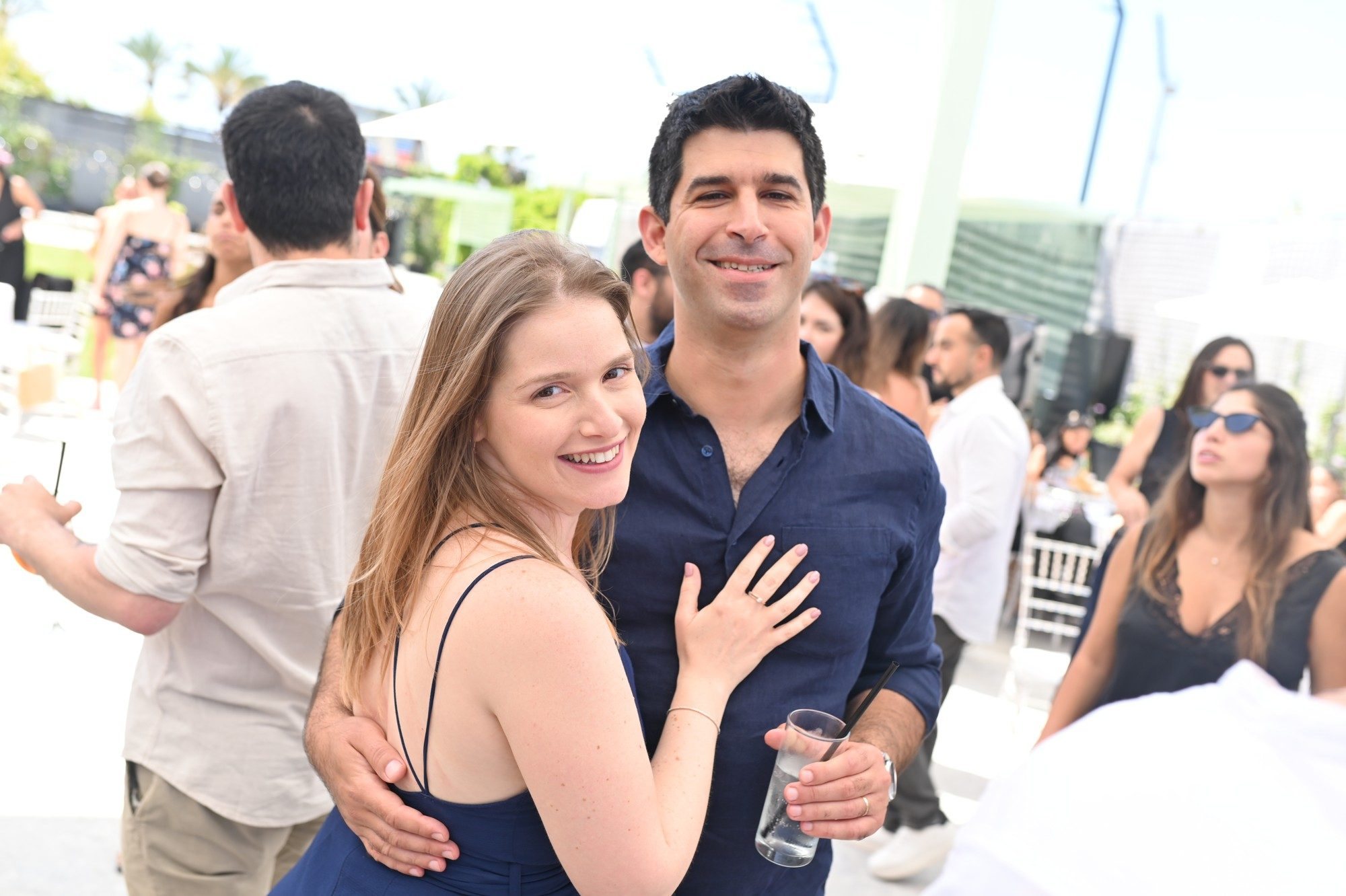 A group of friends smiling together at an event